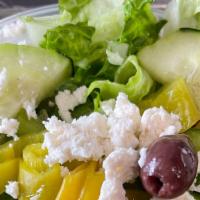 Greek Salad · Lettuce, tomatoes, onion, cucumber, green pepper, feta cheese, olive.