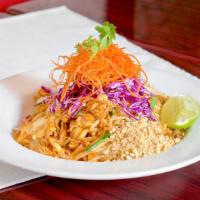 D Pad Thai · Thin rice noodles stir fried in tangy pad thai sauce with egg, chopped tofu, green onion, re...