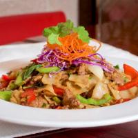 D Drunken Noodle · Wide rice noodles stir fried with egg, onion, bell pepper, Thai chilies, and Thai basil in a...