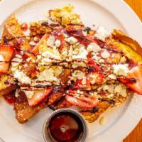 Strawberry French Toast · Veggie. Brioche french toast topped with strawberries, almonds, strawberry sauce, goat chees...