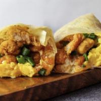 The Colonel · Eggs, hash rounds, popcorn chicken, cheddar cheese, green onion and house burrito sauce.