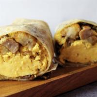 The Attack Of The Meats Burrito  · Eggs, hash rounds, bacon, sausage, ham, chicken, red onion, cheddar cheese, and creamy burri...