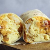 The John Elway Burrito · Eggs, hash rounds, ham, cheddar cheese, red onions, peppers, and salsa verde.