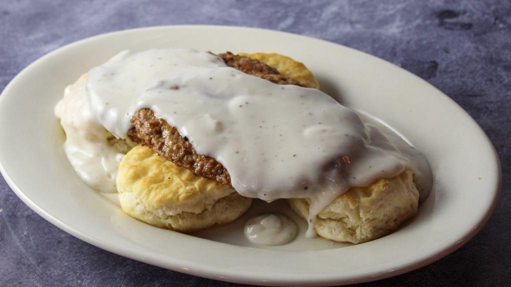 Biscuits And Gravy · Warm biscuits, smothered in gravy and topped with  sausage.
