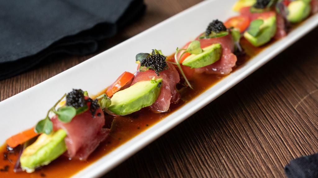 +Bluefin Tuna · Thinly sliced Bluefin, avocado, tobiko with chef's special sauce.