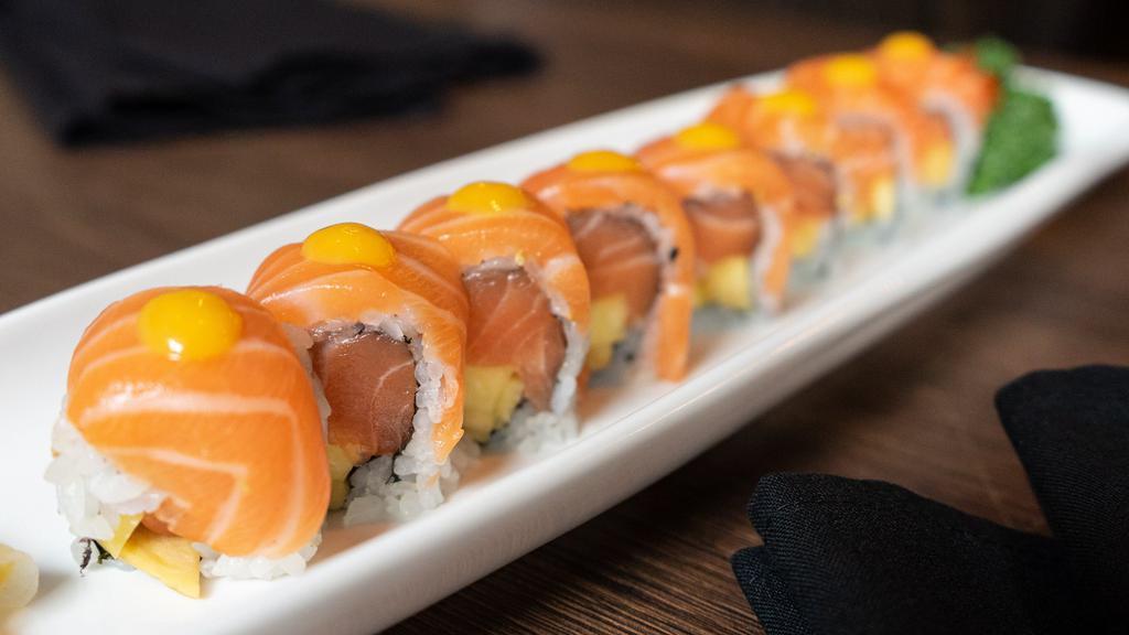 Golden Roll · Salmon, cilantro, mango inside; salmon on top. Served with special sauce.