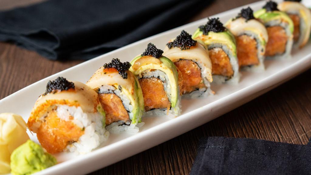 +7. Playboy Roll · Spicy salmon, crunchies inside; topped with lightly seared peppered white tuna (escolar), avocado, tobiko, chili sauce & wasabi mayo sauce.