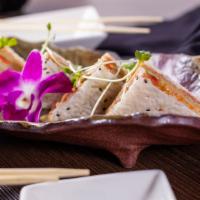 +22. Sandwich · Spicy salmon, spicy tuna and avocado wrapped with sesame soy paper served with spicy mayo an...