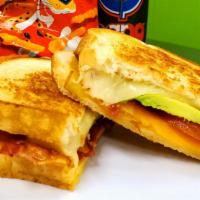 Ultimate Grilled Cheesy · Swiss, Cheddar, Bacon, Tomato & Avocado Choice Of  Grilled Bread.