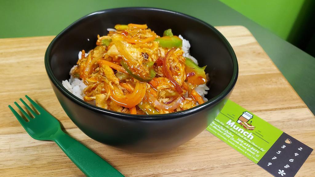 Thai Chili Bowl · Slow- Cooked Chicken, Tomatoes, Onion, Green Pepper & Thai Peanut Sauce Over Rice