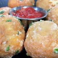 The Original Cheese Balls · Mozzarella cheese wrapped in our artisan dough, fried golden, tossed in garlic Parmesan butt...