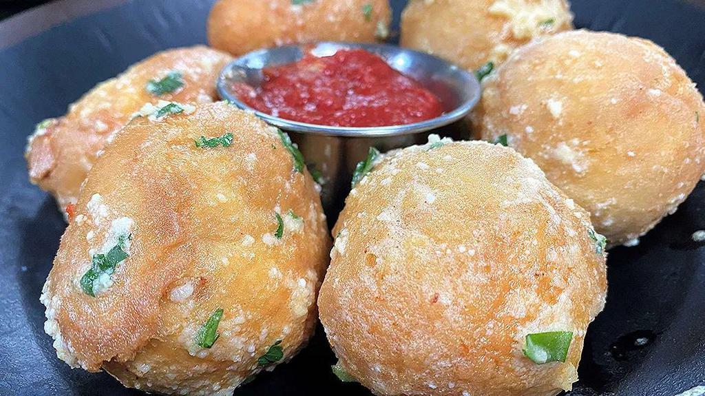 The Original Cheese Balls · Mozzarella cheese wrapped in our artisan dough, fried golden, tossed in garlic Parmesan butter.