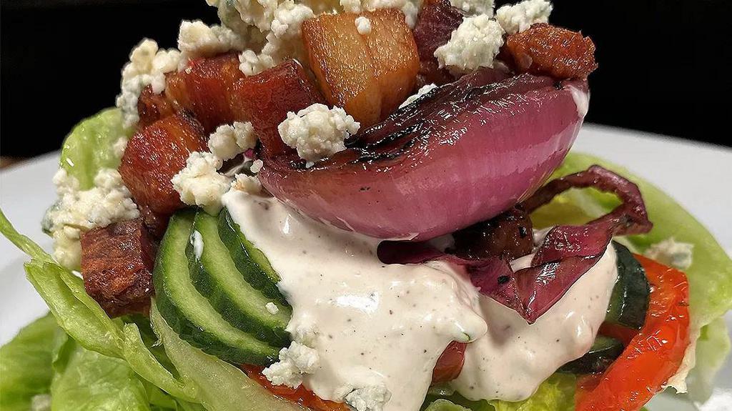 Baby Iceberg Wedge · Cucumber ribbons, Shaft's blue cheese, oven-roasted tomato, balsamic grilled red onion, Nueske bacon, blue cheese dressing.