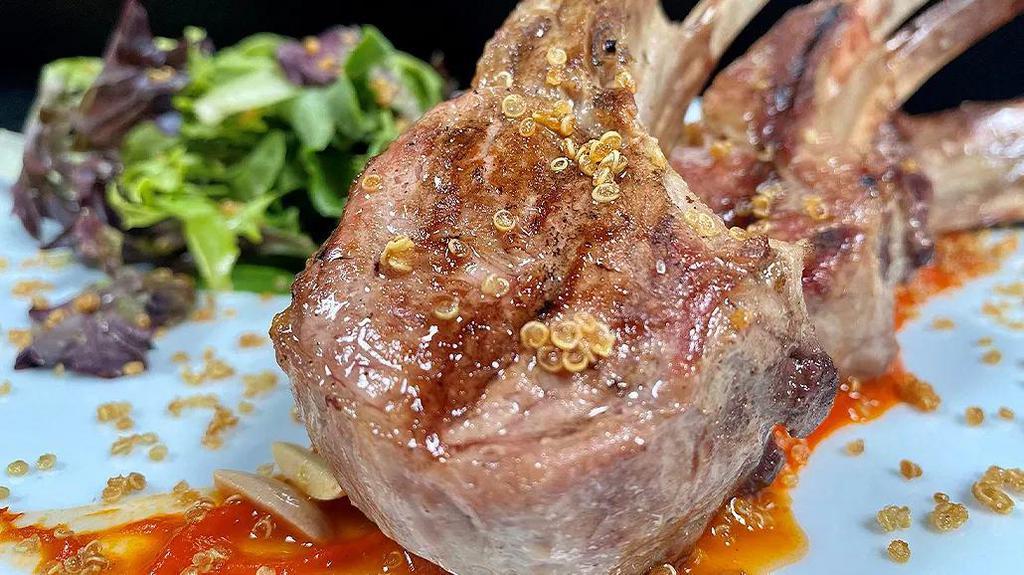 Taphouse Lamb Chops · Half rack grilled lamb, smoked paprika, piquillo pepper coulis, frisee, white quinoa almond crunch, parsley, jalapeño mint jam.