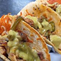 Electric Tacos · Cheve lager marinated carne asada, chorizo pork belly, caramelized rajas, string cheese, sal...