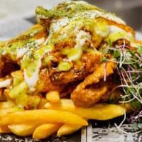 Bollywood To Hollywood Fries · Crispy Fries Loaded with Butter Chicken Curry (Chicken Makhni), Raita Sauce, Tomatillo Chutn...
