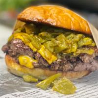 Duke City Smash  Burger · Two Smashed Beef Patties, Cheese, Hot Green Chile & Sauteed Onions on Local Baked Bun. Serve...