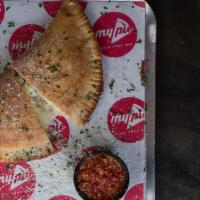 Calzone Your Way · Create your own Calzone with over two dozen toppings. Served with warm homemade marinara sau...