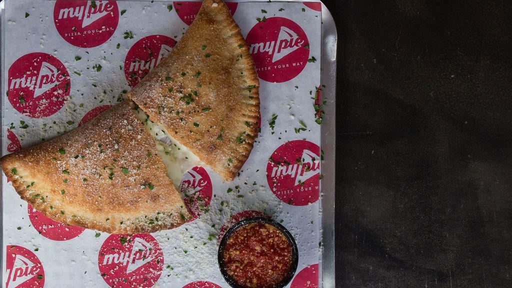 Calzone Your Way · Create your own Calzone with over two dozen toppings. Served with warm homemade marinara sauce.