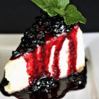 Huckleberry Cheesecake · Rich & creamy NY style cheesecake with a traditional graham cracker crust. Drizzled with hou...