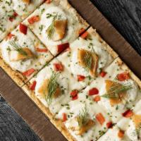 Yellowstone Flatbread · Garlic olive oil, mozzarella, lemon-infused ricotta, smoked trout, red bell peppers, garnish...