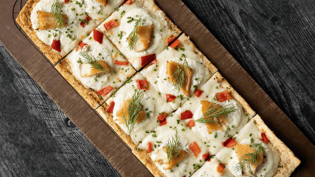 Yellowstone Flatbread · Garlic olive oil, mozzarella, lemon-infused ricotta, smoked trout, red bell peppers, garnished with fresh chives and dill (cal 830)