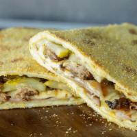 Cuban Piadina Sandwich · Roasted pork, Black Forest ham, Swiss, pickles & yellow mustard folded & baked inside a cris...