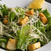 Caesar · Romaine, shredded parmesan & seasoned croutons tossed in Caesar dressing. Anchovies by reque...