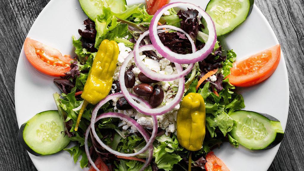 Greek · Sliced cucumbers, Kalamata olives, tomatoes, red onions, pepperoncinis & feta cheese over crisp greens. Served with Greek feta dressing. (cal 320-630)