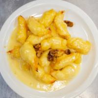Walnut Shrimp Or Chicken · Delicately seasoned jumbo shrimp or chicken, lightly fried to golden brown in white creamy s...