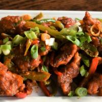 Chicken 65 · Spicy crispy chicken tossed with bell peppers, garlic, and chili sauce.