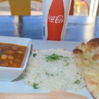 Chole Masala Combo · Garbanzo beans cooked with onions, potatoes, tomatoes and spices. Served with Rice Pulav, Bu...