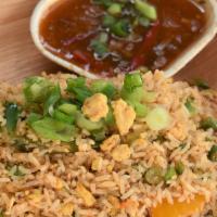 Egg Fried Rice · Street style fried rice with eggs and vegetables. Served with hot and sweet sauce