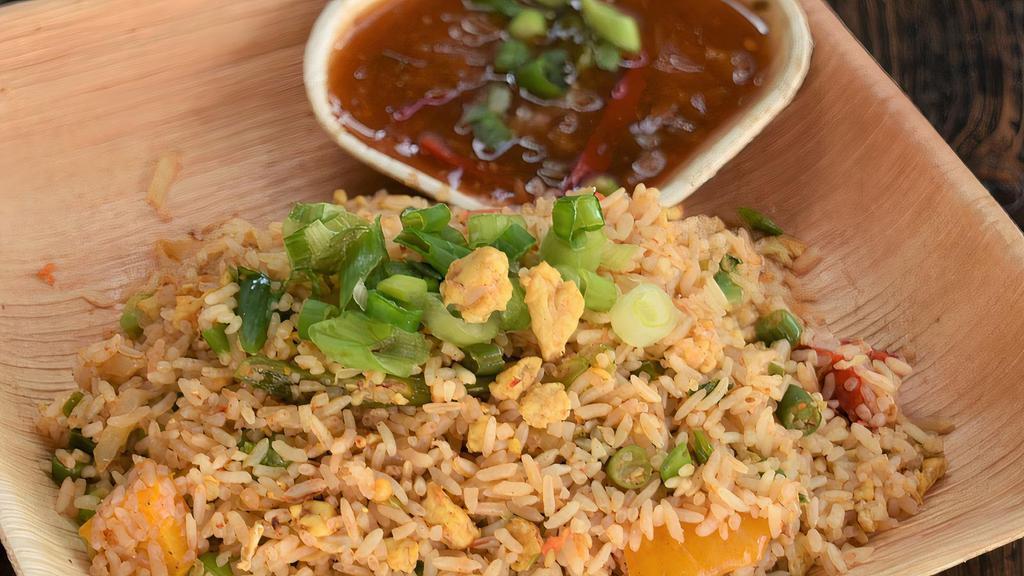 Egg Fried Rice · Street style fried rice with eggs and vegetables. Served with hot and sweet sauce