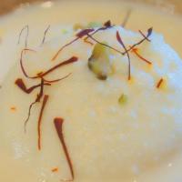 Rasmalai · Soft cheese balls soaked in flavored delicate milk sauce, topped with nuts.