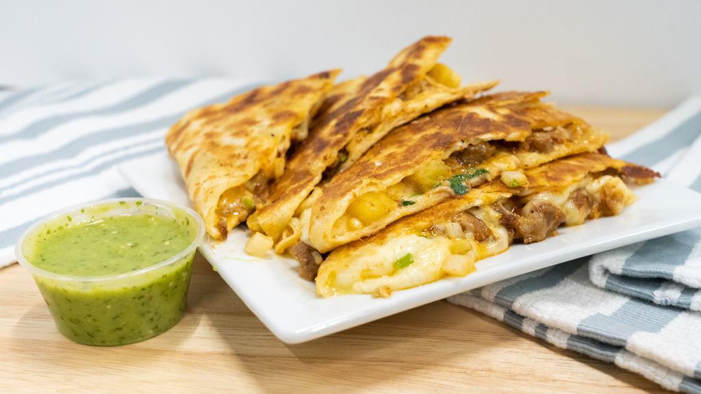 Quesadilla · Favorite. Your choice of meat or veggie, melted cheese on flour tortillas, onions and cilantro with a side of salsa verde.