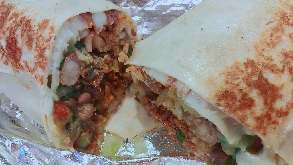 Burrito · Favorite. Your choice of meat or veggies wrapped in a flour tortilla filled with pinto beans, rice, cheese, onions, cilantro, salsa verde and a side of salsa roja.