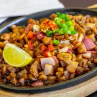 Sisig · Minced pork marinated in calamansi juice (Philippine lemon), onions tossed in a tangy sauce ...