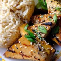 Grilled Teriyaki Tofu · Surata Tofu Marinated in Teriyaki & Grilled. Served with Rice and Choice of Macaroni Salad o...