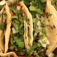 Street Taco · Meat, onion, cilantro and salsa.