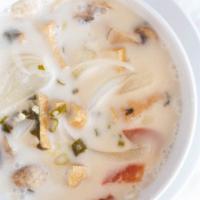 Tom Kha Cup · Hot and sour soup with coconut milk, galangal root, mushrooms, lemongrass, lime leaves. Garn...