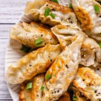 Chicken Dumplings · Five pieces of dumplings filled with seasoned chicken fried till golden-brown.