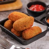 Jalapeño Poppers · Four pieces of jalapeños stuffed with a mixture of cheese and spices fried till golden-brown.