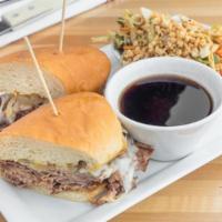 Tri-Tip Dip Sandwich · Our house roasted tri-tip dip thinly sliced served au jus with caramelized onions. Creamy ho...