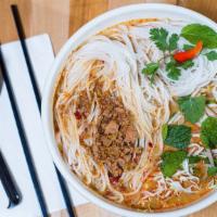 #6 Kao Poon · A traditional spicy Lao rice vermicelli chicken and pork noodles coconut chili soup with shr...