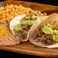 Two Carne Asada Tacos · Two carne asada tacos (steak) topped with guacamole and pico de gallo. Served with rice and ...