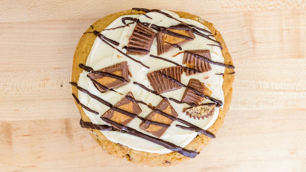 Peanut Butter Cup  · We took our famous chocolate chip cookie, topped it with homemade peanut butter buttercream frosting, Reese’s cups and dark chocolate drizzle. It’s the perfect balance of chocolate and peanut butter.