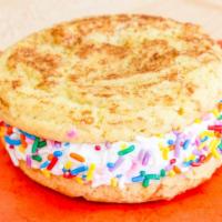 Snickerdoodle Avalanche · A heaping scoop of vanilla buttercream frosting sandwiched between two snickerdoodle cookies...