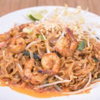 Pad Tom Yum · Stir fried rice noodles, egg, green onions, basil, and bean sprout in tom yum sauce.