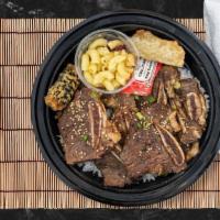 Kalbi Kick Bowl · Kalbi (beef rib) marinated daily in a house made sauce and grilled to perfection. Served wit...